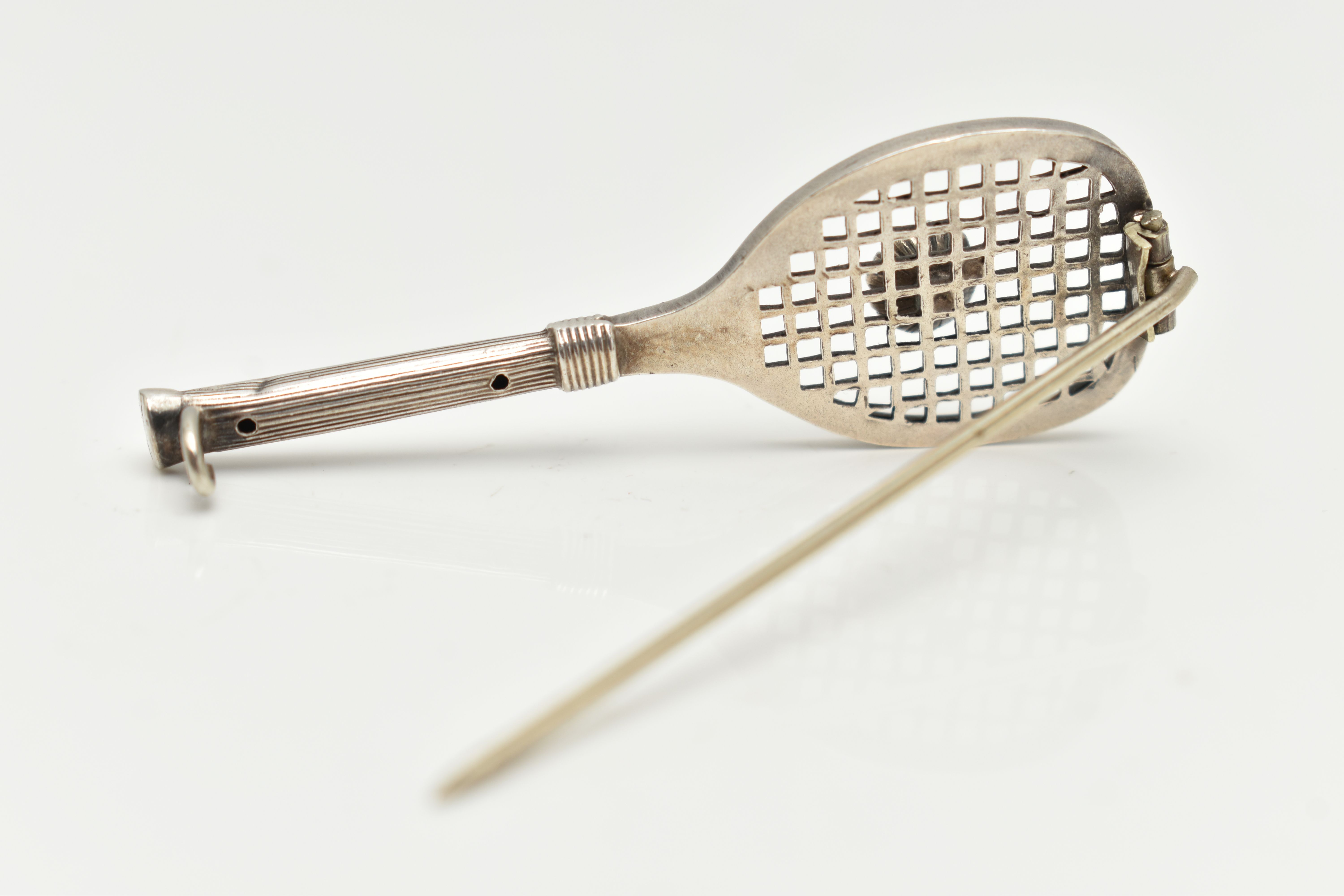 A WHITE METAL BROOCH, in the form of a tennis racket set with a colourless paste imitating a - Image 4 of 4