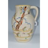 A CLARICE CLIFF SINGLE HANDLED LOTUS JUG, in Tiger Tree pattern, painted with a stylised tree on a