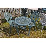 A GREEN PAINTED CAST ALUMINIUM GARDEN TABLE AND A PAIR OF SIMILAR CHAIRS with foliate detail to