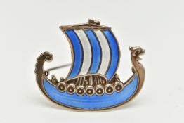 A WHITE METAL NORWEGIAN ENAMEL BROOCH, in the form of a Viking ship, decorated with blue and white