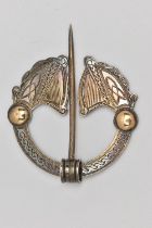 AN IRISH SILVER PENANNULAR CELTIC BROOCH, designed as two harps with yellow metal embellishments,