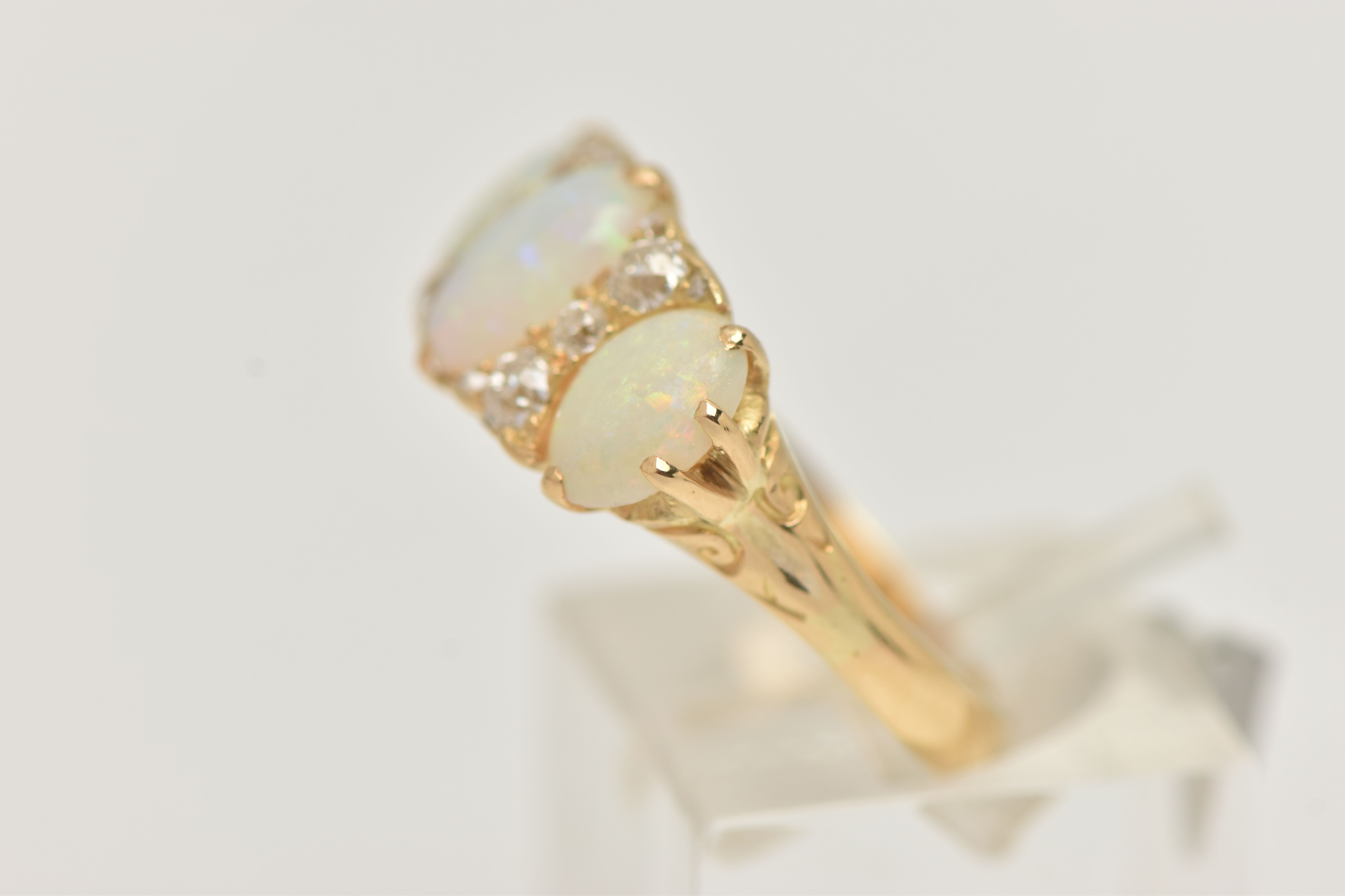 AN EARLY 20TH CENTURY OPAL AND DIAMOND RING, set with graduating oval opal cabochons, measuring from - Image 2 of 4