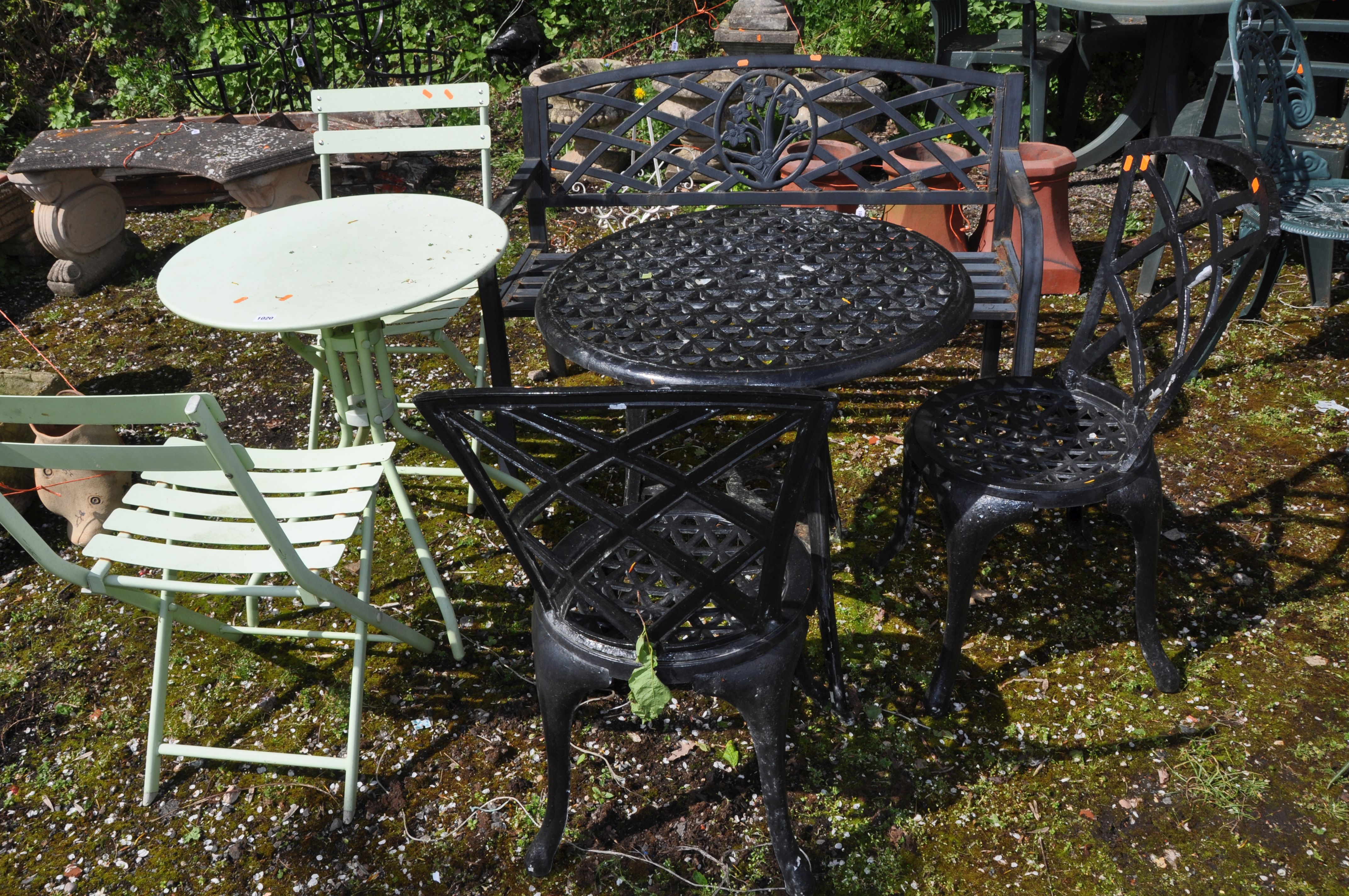 A COLLECTION OF METAL GARDEN FURNITURE including a rickety cast aluminium garden table, two matching