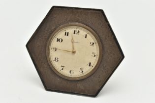 A SILVER 8 DAY BEDSIDE TABLE CLOCK, hexagonal form, engine turned pattern, with a round silvered