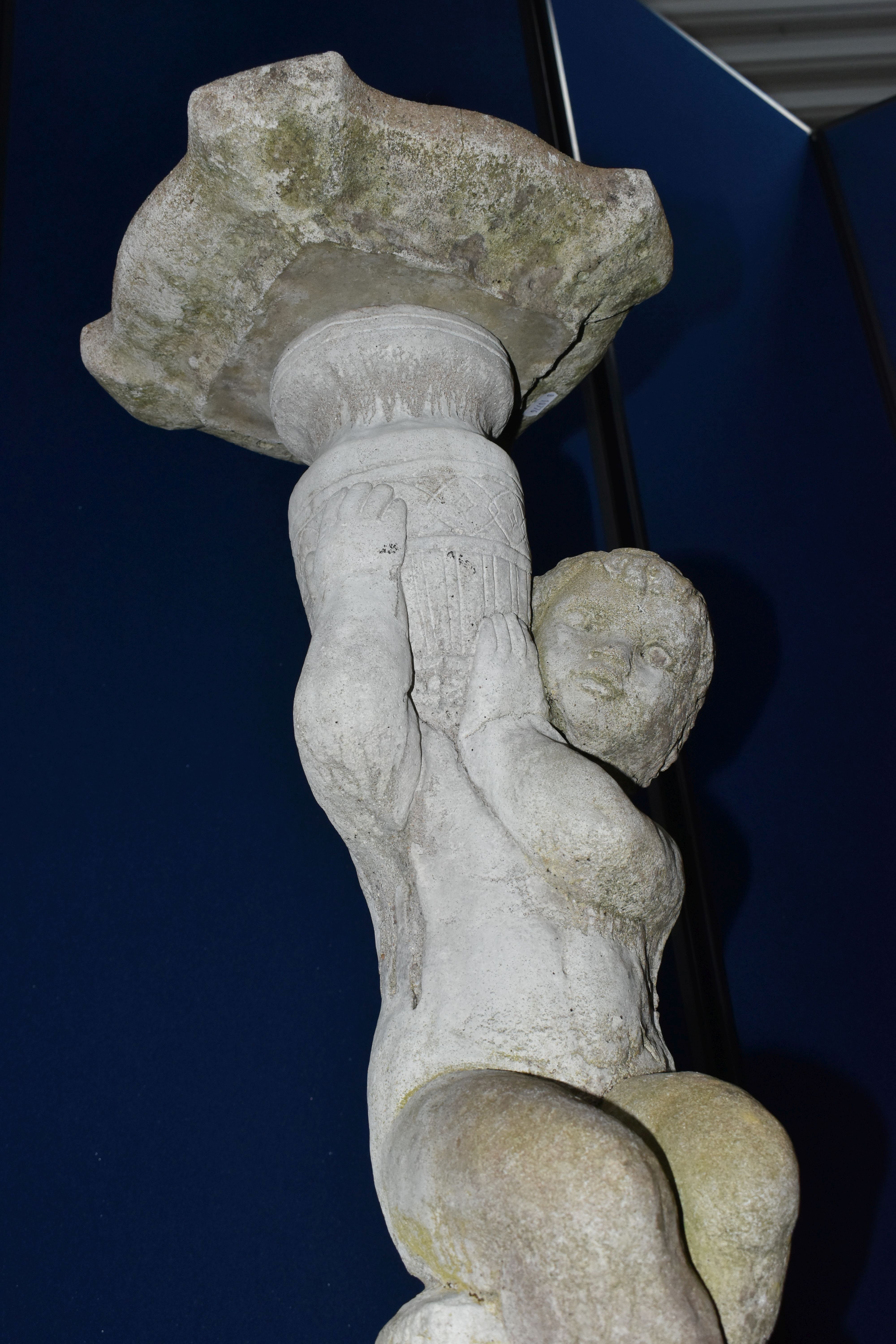A WEATHERED COMPOSITE SUN DIAL, the top is raised on a seated putti holding an urn aloft, diameter - Image 6 of 10