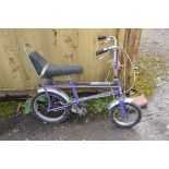 A RALEIGH TOMAHAWK VINTAGE CHILDS BIKE in purple Condition Report: bench seat in good order, paint