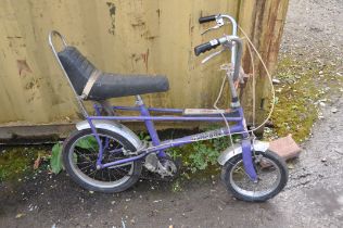 A RALEIGH TOMAHAWK VINTAGE CHILDS BIKE in purple Condition Report: bench seat in good order, paint
