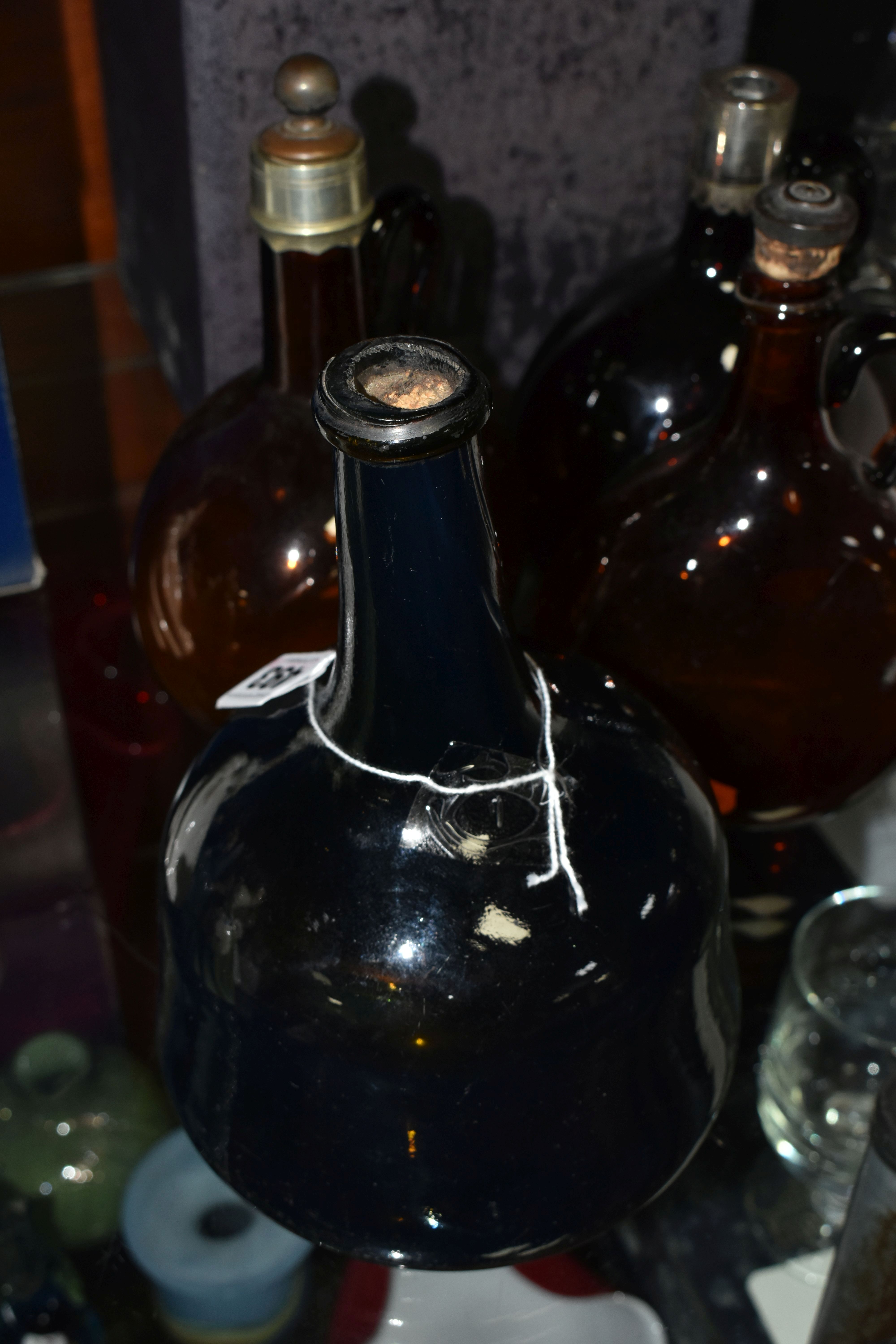 AN 18TH CENTURY MALLET SHAPED AMBER COLOURED BOTTLE, approximate height 21cm, together with three - Image 3 of 9