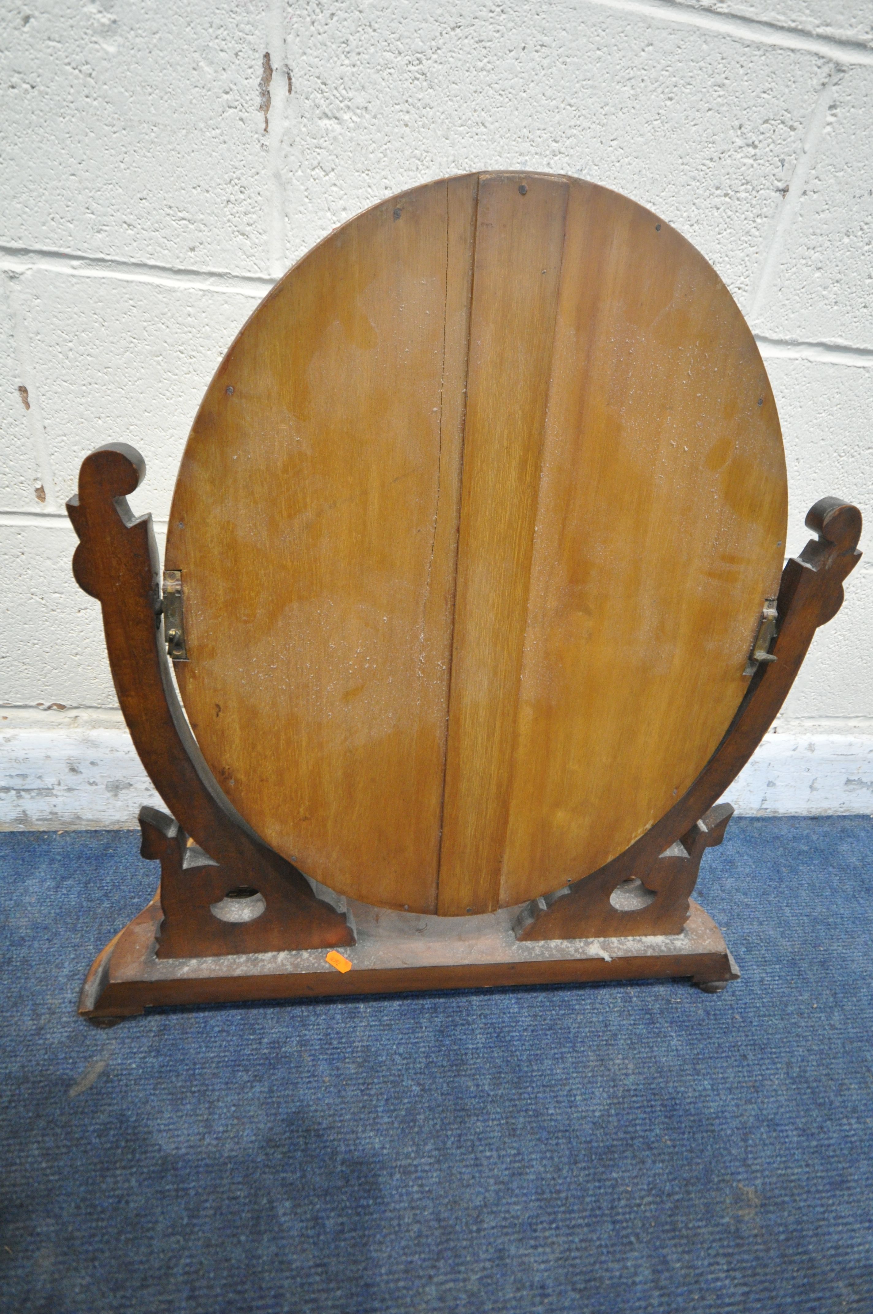 A VICTORIAN MAHOGANY TOILET MIRROR, the oval frame encasing a bevelled mirror plate, scrolled - Image 6 of 6