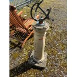 AN ARMILLARY SPHERE BRASS SUNDIAL ON A COMPOSITE COLUMN BASE with foliate panels and 'Tempus