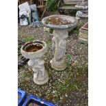 TWO WEATHERED COMPOSITE BIRD BATHS in the form of three ladies around a column and three children