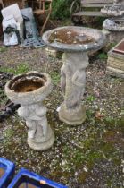 TWO WEATHERED COMPOSITE BIRD BATHS in the form of three ladies around a column and three children