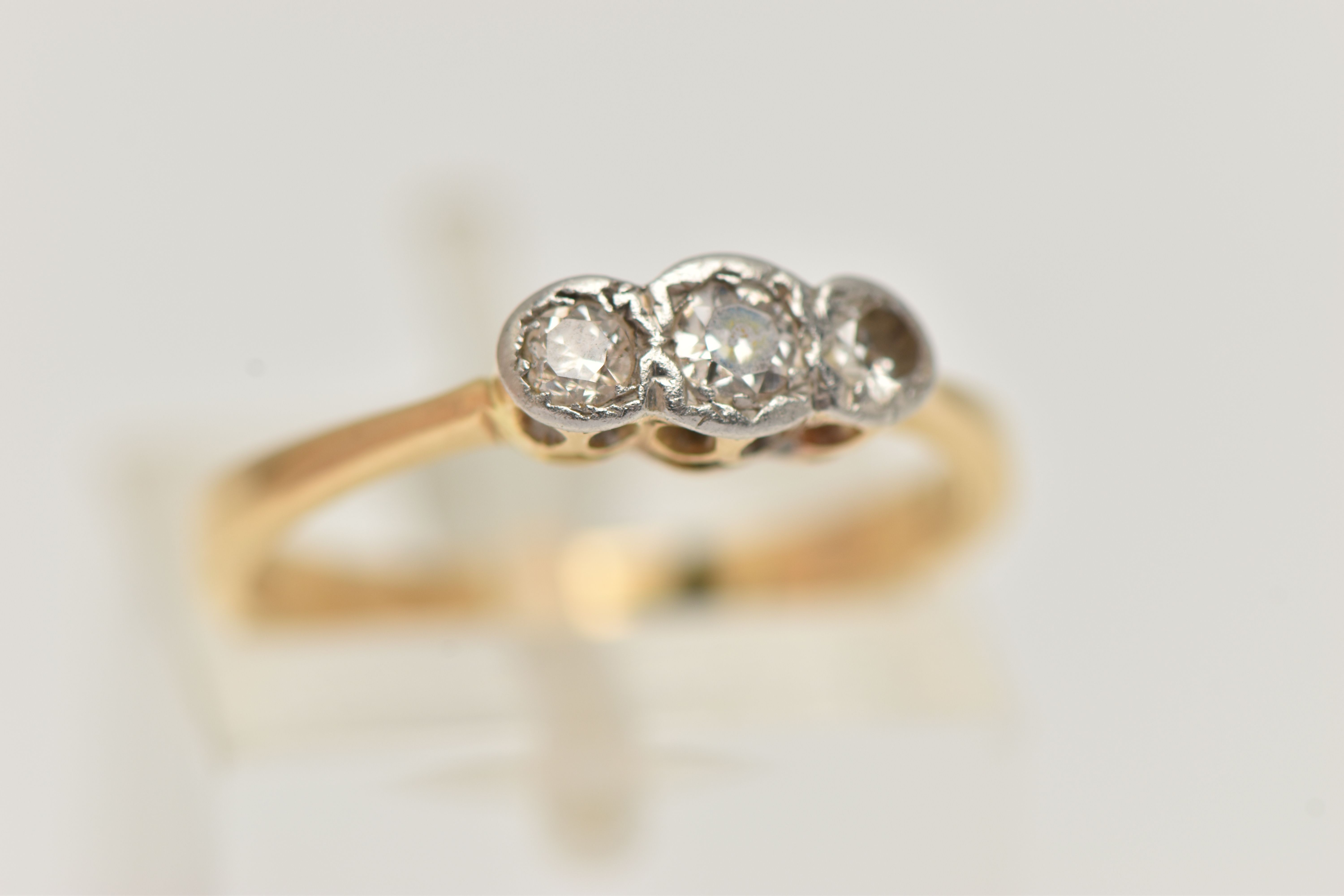 A DIAMOND THREE STONE RING, set with graduating transition cut diamonds, measuring from - Image 4 of 4