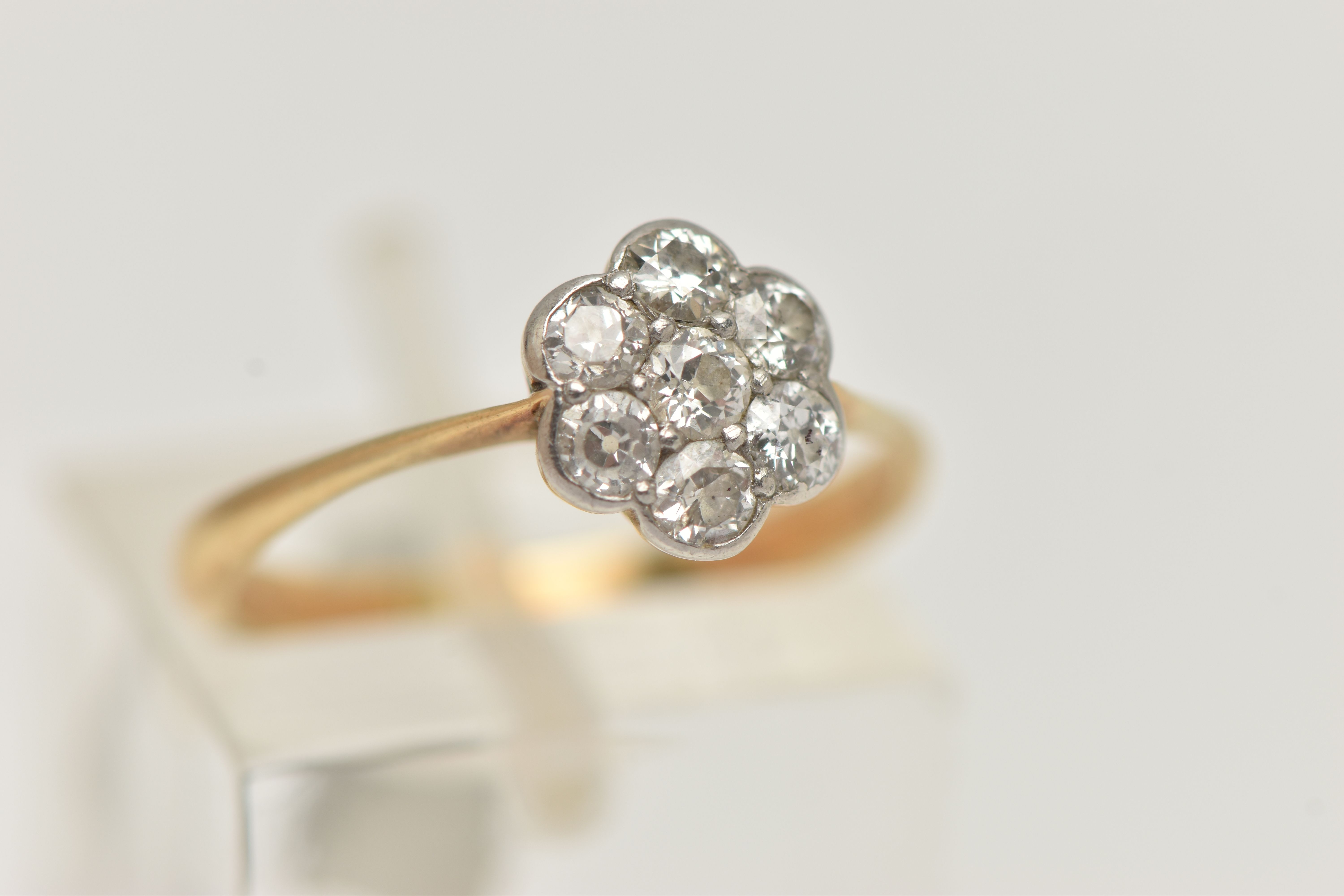 A YELLOW METAL DIAMOND CLUSTER RING, flower shape cluster set with seven old cut diamonds, estimated - Image 4 of 4