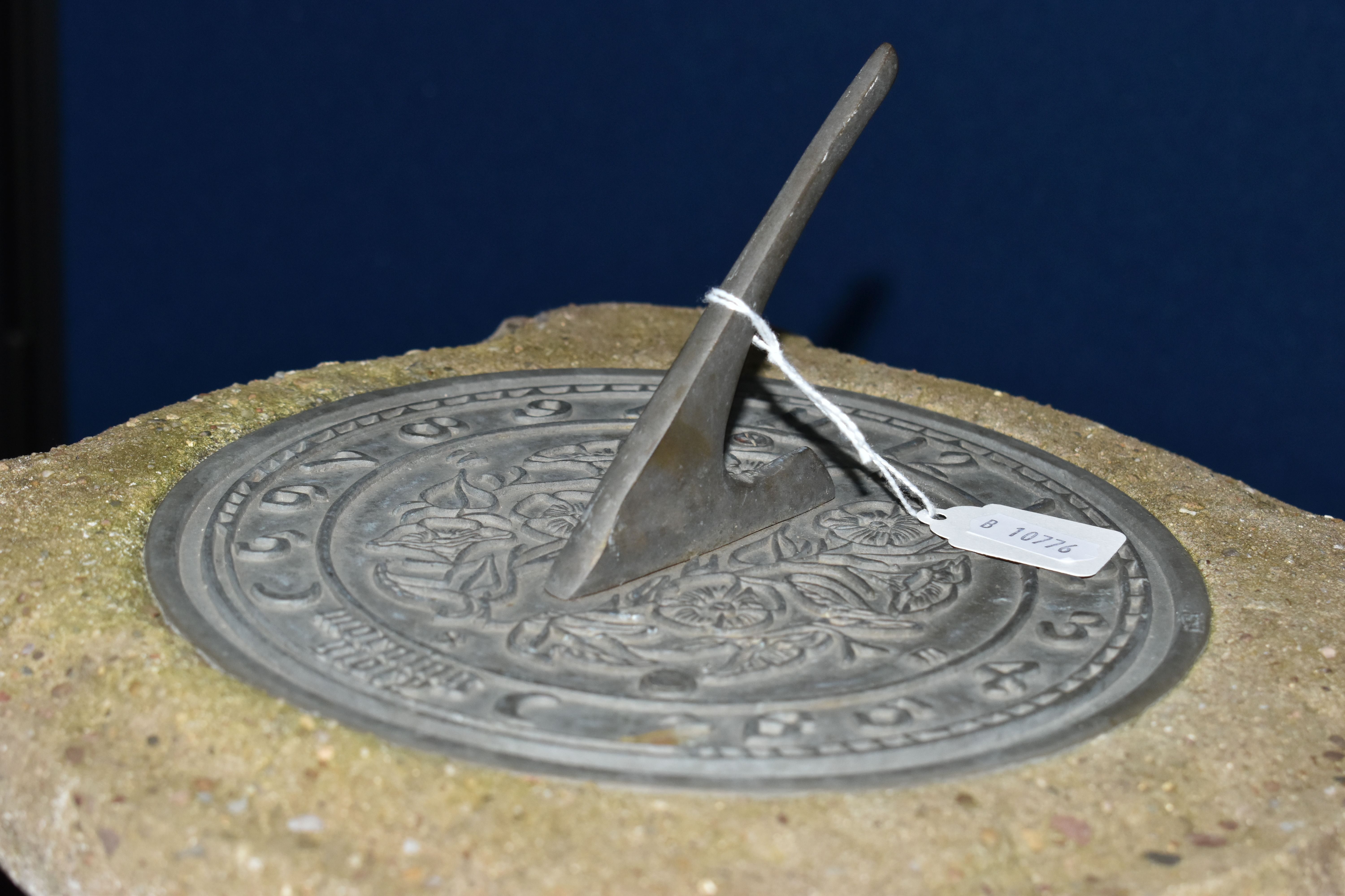 A WEATHERED COMPOSITE SUN DIAL, the top is raised on a seated putti holding an urn aloft, diameter - Image 4 of 10