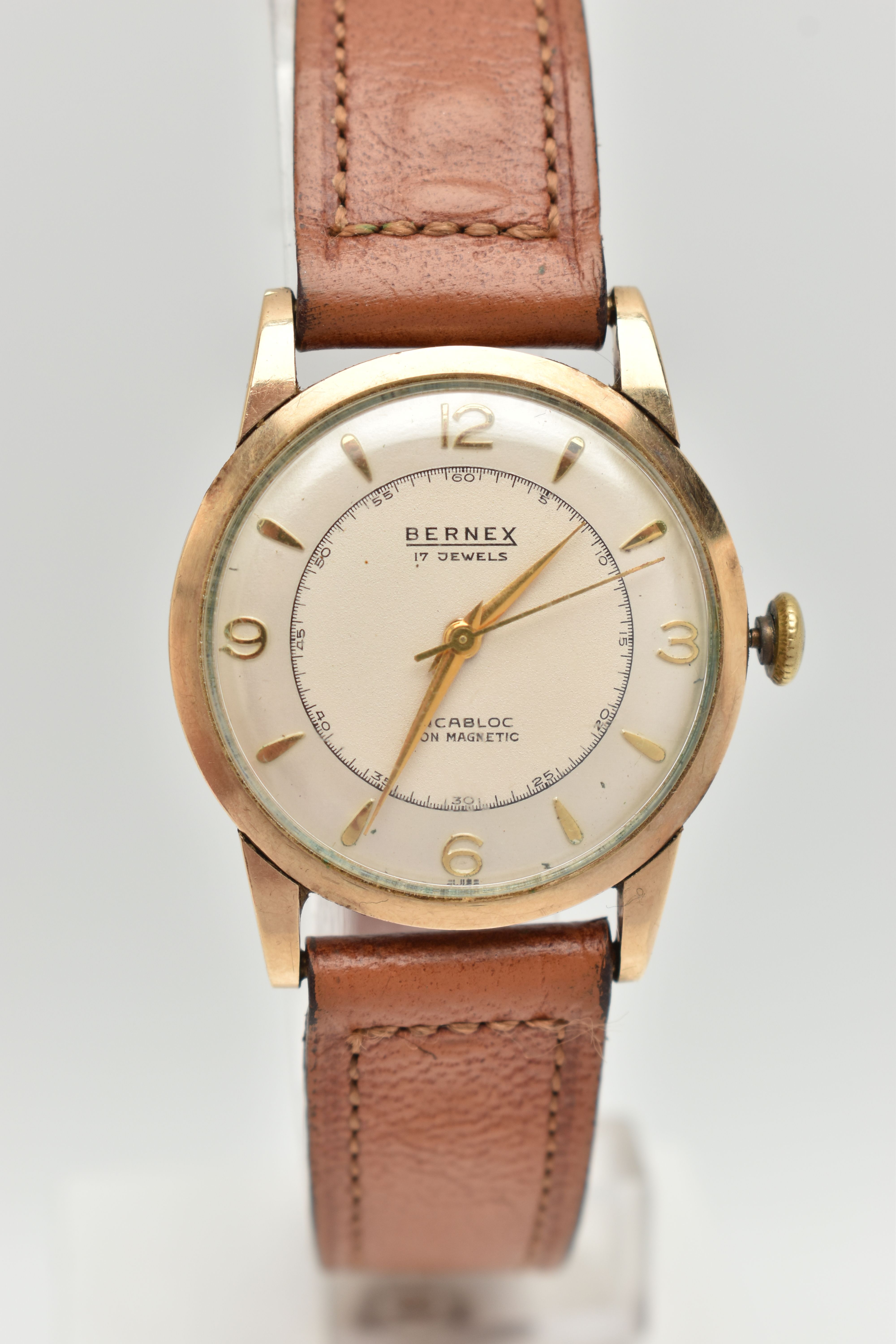 A YELLOW METAL 'BERNEX' WRISTWATCH, hand wound movement, round dial signed 'Bernex', baton