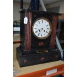 A VICTORIAN BLACK SLATE MANTLE CLOCK, inset with red marble accents, the enamel dial marked