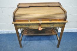 ANGUS OF LONDON, AN EARLY 20TH CENTURY WALNUT ROLL TOP DESK, with a raised shelf, the tambour door