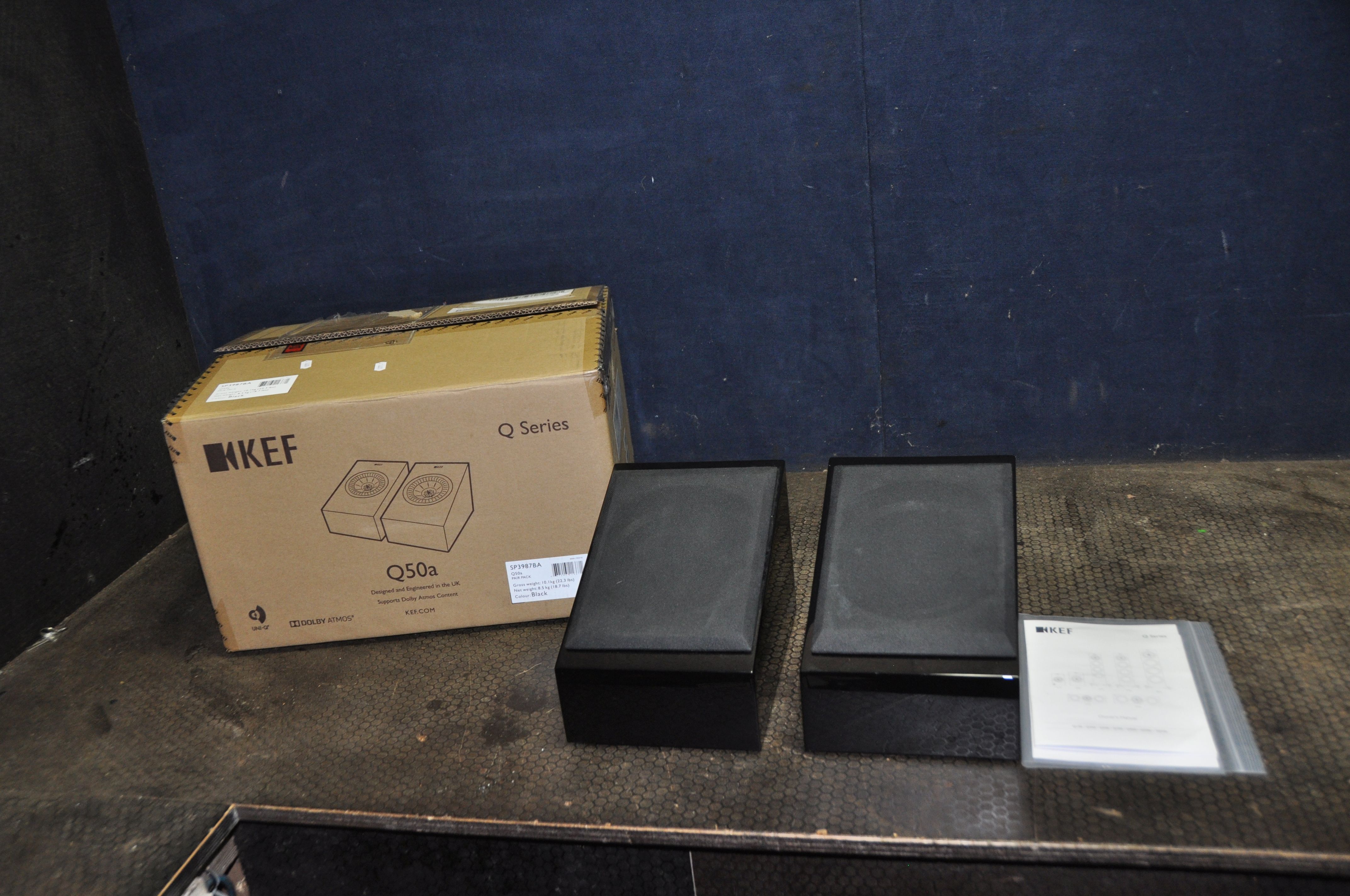 A PAIR OF KEF R50 IN GLOSS BLACK FINISH in a Q50a box with Guarantee card and manuals