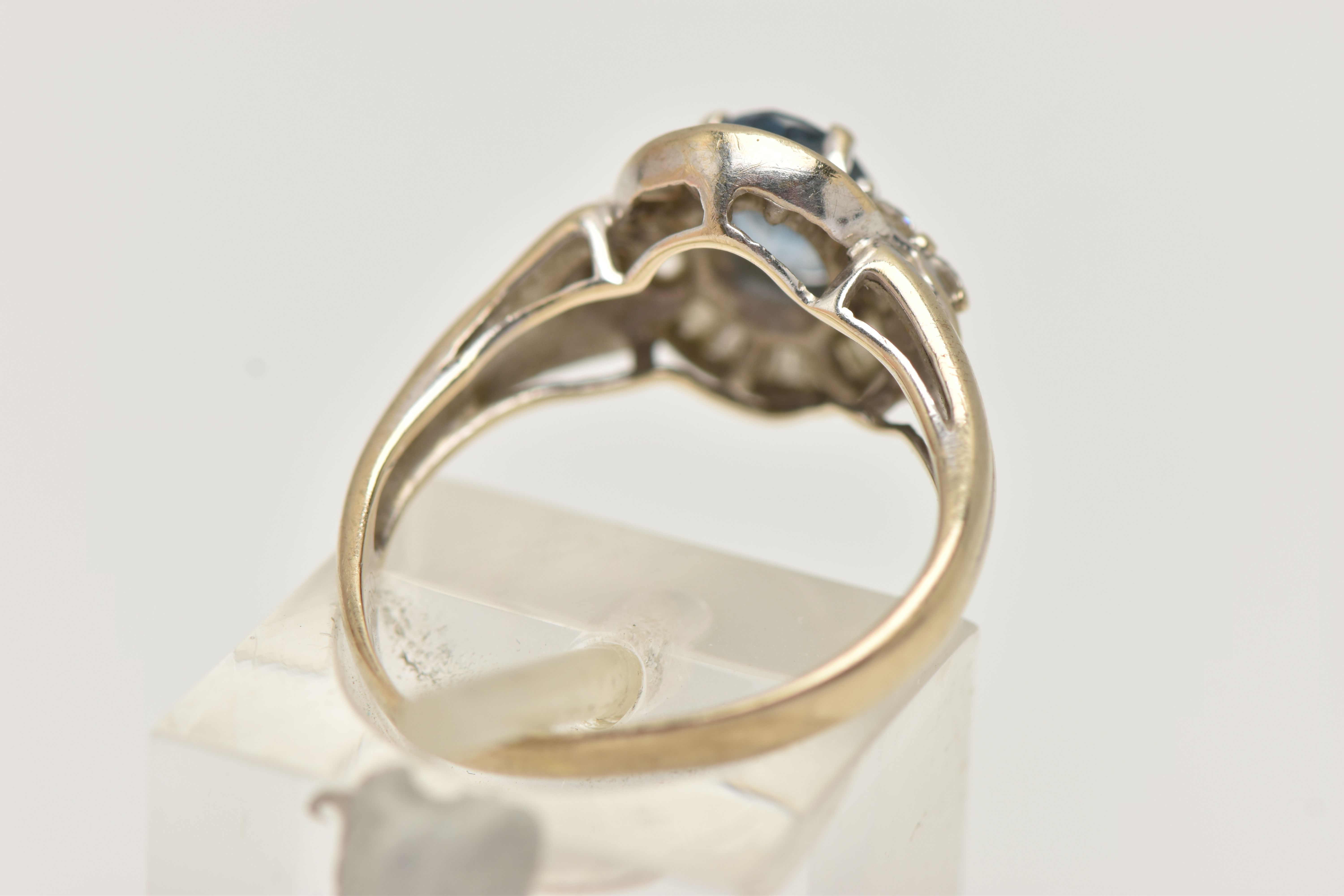 A WHITE METAL SAPPHIRE AND DIAMOND RING, set with an oval cut sapphire, measuring approximately 7. - Image 3 of 4