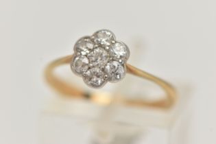 A YELLOW METAL DIAMOND CLUSTER RING, flower shape cluster set with seven old cut diamonds, estimated