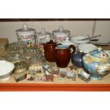 A COLLECTION OF JELLY MOULDS AND LIMOGES SAUCEPANS, comprising five clear glass jelly moulds, a late