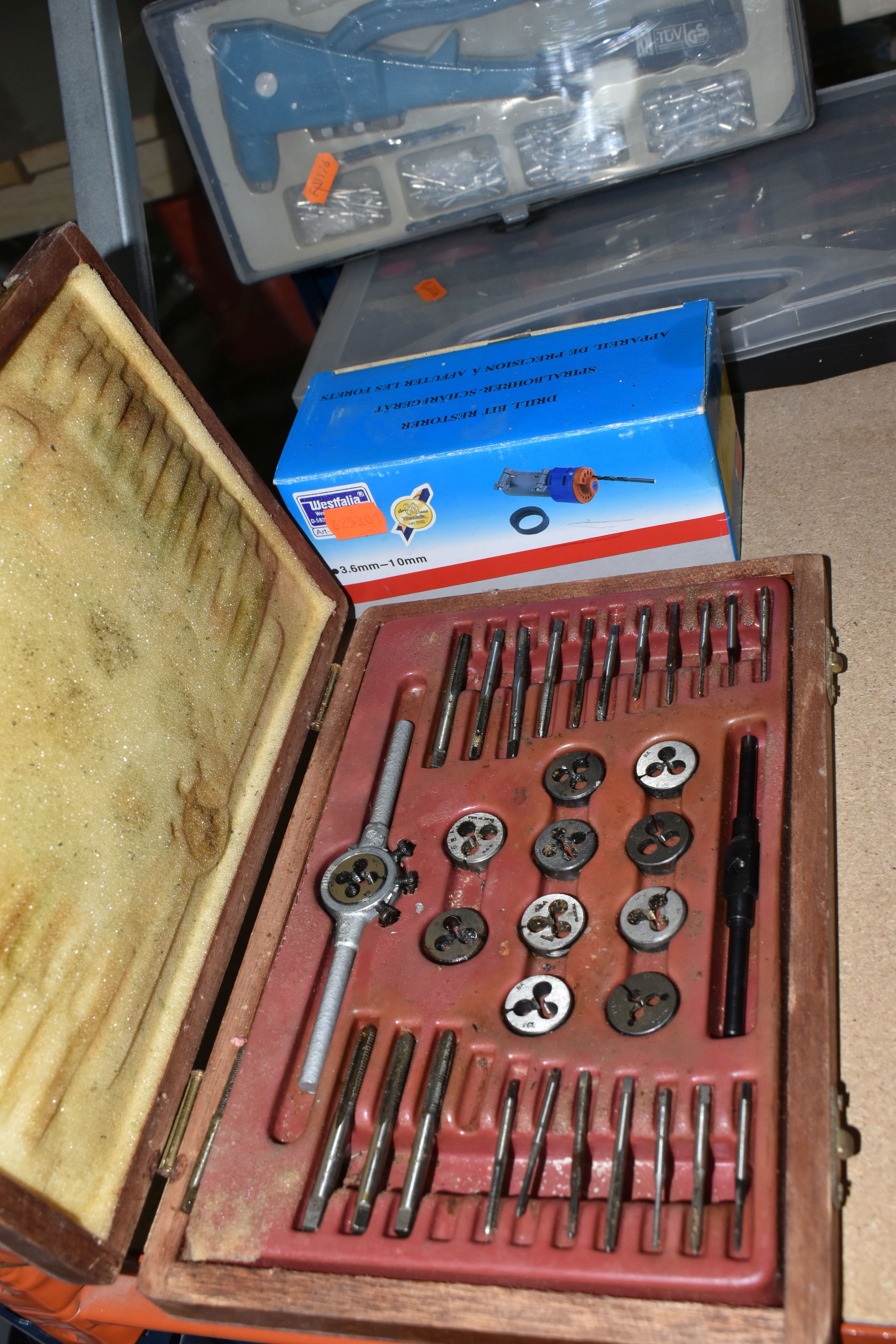 A GROUP OF CASED OR BOXED TOOLS, to include a tap and die set in a wooden case (one piece