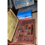 A GROUP OF CASED OR BOXED TOOLS, to include a tap and die set in a wooden case (one piece