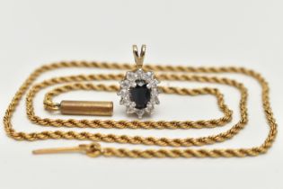 A 9CT GOLD CLUSTER PENDANT AND A YELLOW METAL CHAIN, oval cluster set with a central oval cut deep