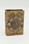 A WWI TRENCH ART BRASS MATCHBOX SLEEVE WITH SCOTS GUARD BADGE TO THE FRONT, stamped '1914 1918