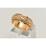 A FLORAL BAND RING, with personal engraving to inner band, stamp rubbed, believed to read 750,