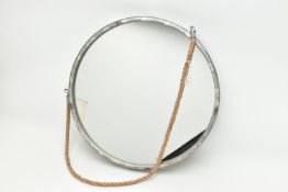 A MODERN CIRCULAR WALL MIRROR WITH GALVANISED METAL EFFECT FRAME AND ON A COARSE ROPE HANGER,