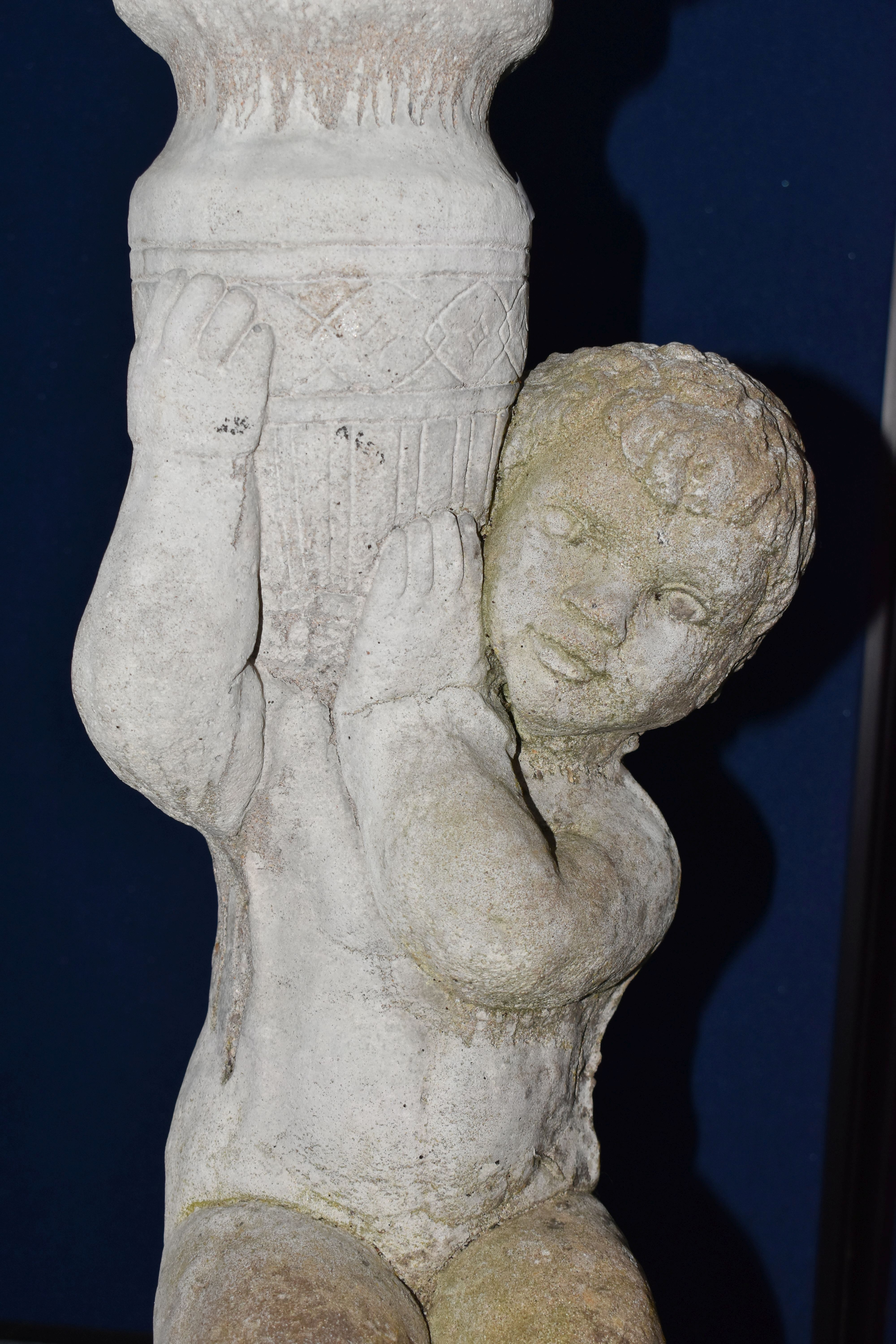 A WEATHERED COMPOSITE SUN DIAL, the top is raised on a seated putti holding an urn aloft, diameter - Image 5 of 10