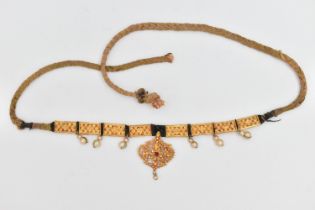 AN INDIAN NECKLACE, designed with a central fancy floral and beaded pendant with central ruby