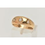 AN EARLY 20TH CENTURY 18CT YELLOW GOLD DIAMOND THREE STONE RING, set with graduating old European