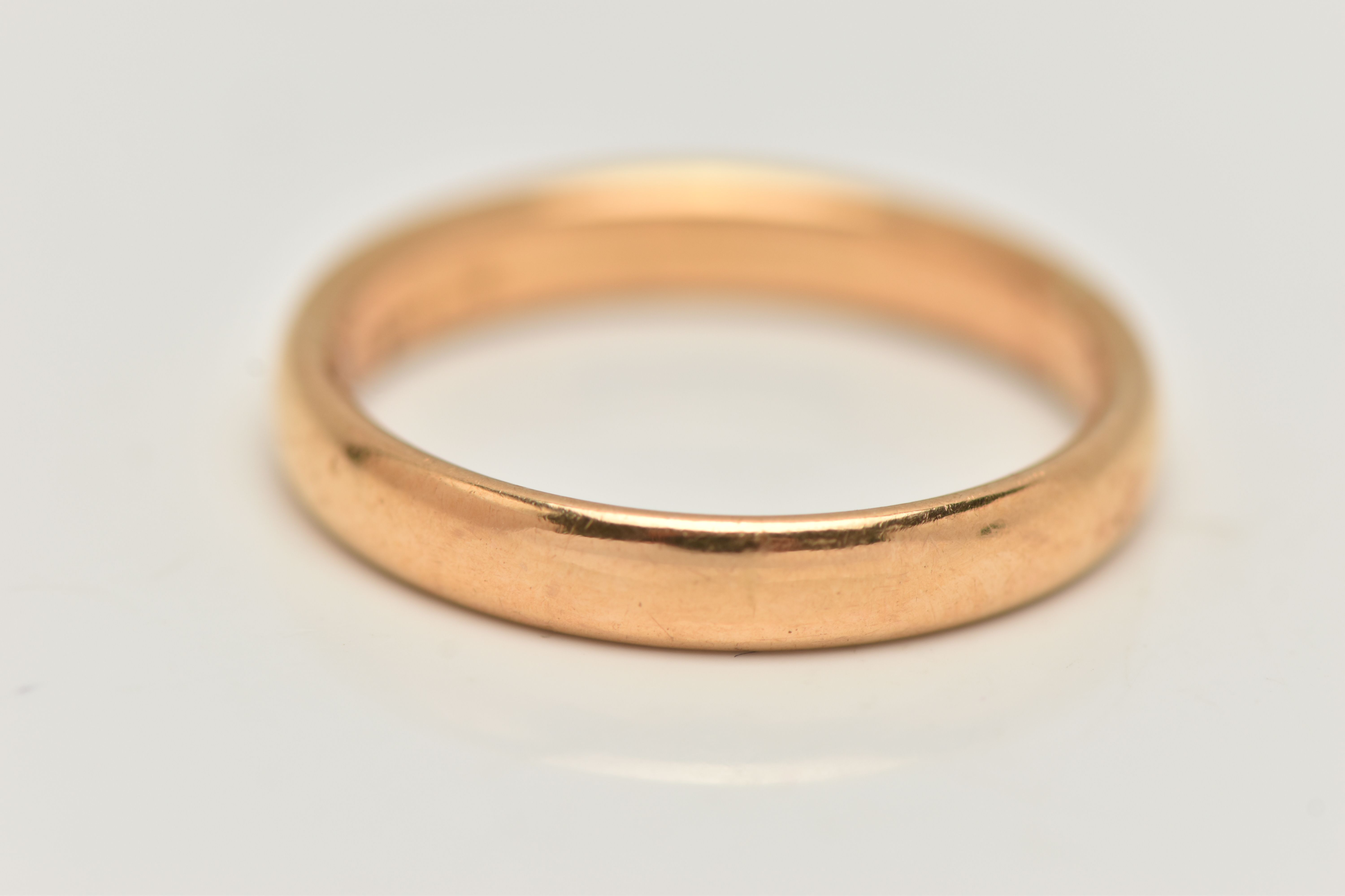 A YELLOW METAL BAND RING, polished band, unmarked, ring size N 1/2, approximate gross weight 4.8 - Image 2 of 2