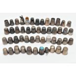 A BAG OF WHITE METAL THIMBLES, various designs and patterns, some set with semi-precious stone