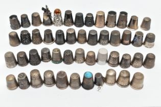 A BAG OF WHITE METAL THIMBLES, various designs and patterns, some set with semi-precious stone