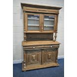 A 20TH CENTURY OAK DRESSER, the top section fitted with double glazed doors, that are enclosing