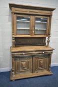 A 20TH CENTURY OAK DRESSER, the top section fitted with double glazed doors, that are enclosing
