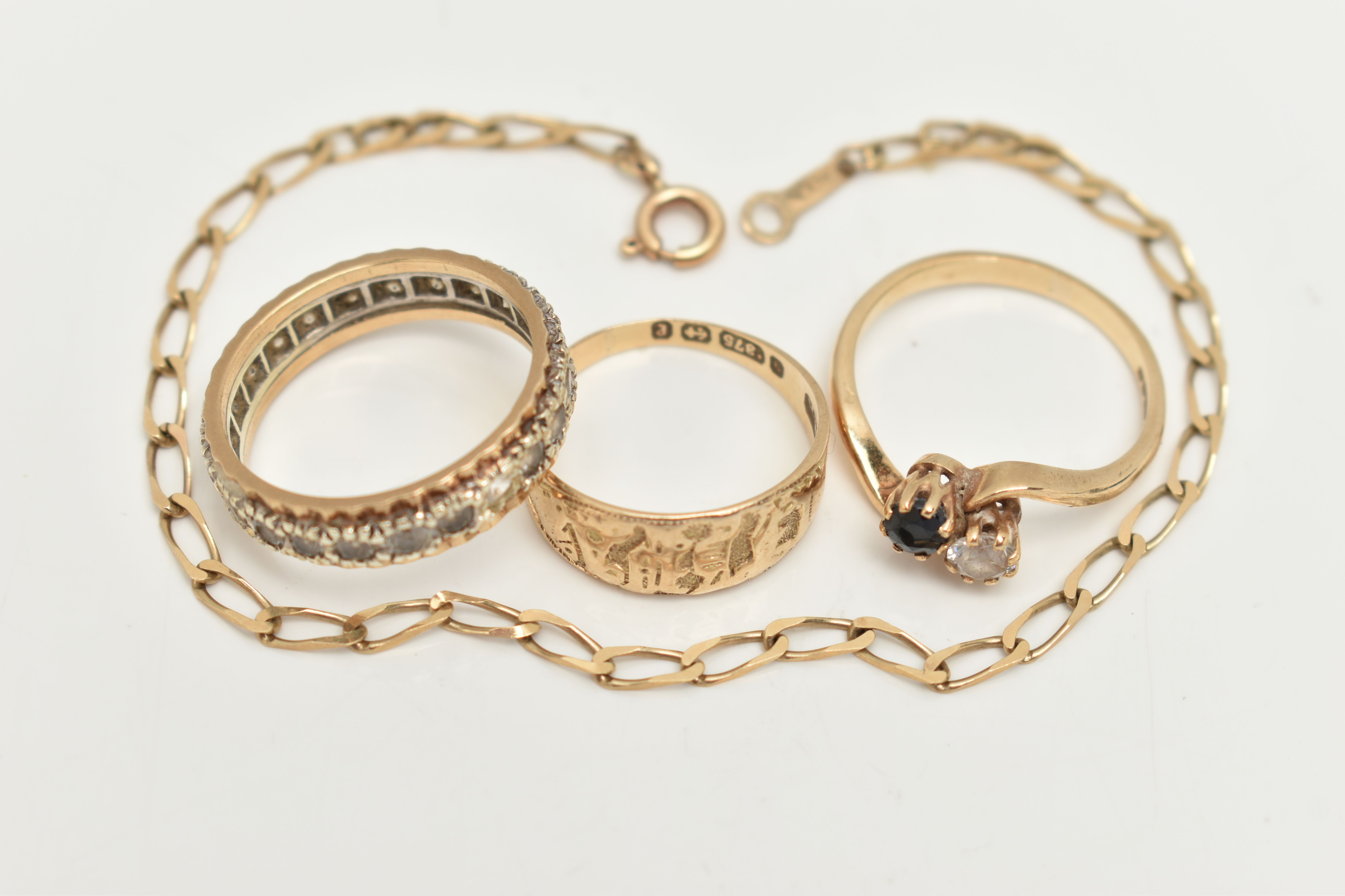 A 9CT GOLD BRACELET AND THREE RINGS, a yellow gold elongated curb link bracelet, fitted with a - Image 2 of 5