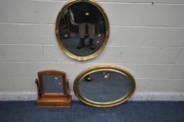 A GILT FRAMED OVAL BEVELLED EDGE WALL MIRROR, 80cm x 61cm, another gilt framed wall mirror and a
