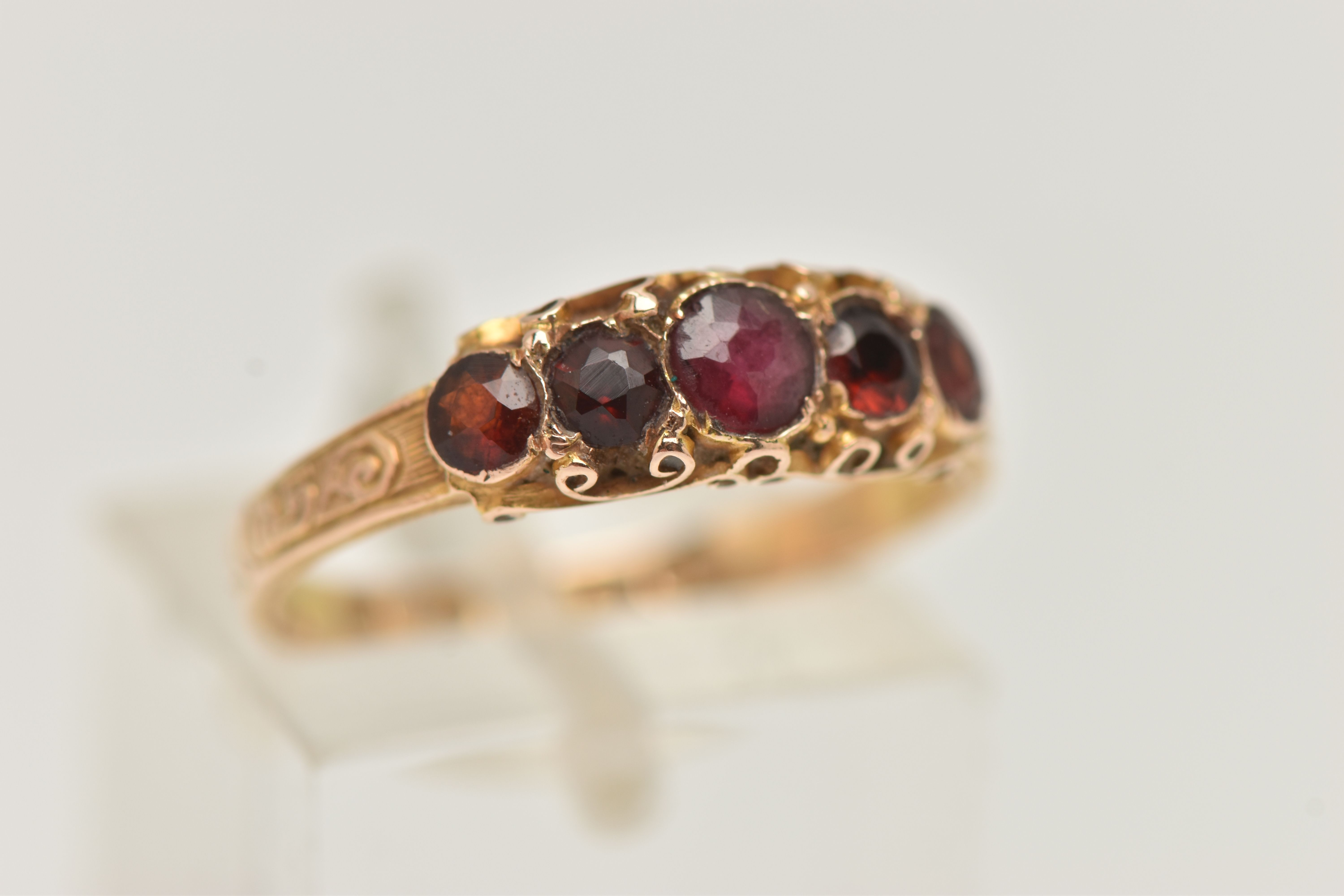 A 15CT GOLD MID VICTORIAN GARNET RING, five circular cut garnets set in yellow gold, scrolling - Image 4 of 4