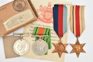 A BOXED SET OF FOUR SECOND WORLD WAR MEDALS, to include a 1939-45 Battle of Britain Star, with