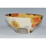 A CLARICE CLIFF BIZARRE BOWL, in Rhodanthe pattern, the ribbed bowl painted with flowers in autumnal