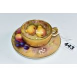 A ROYAL WORCESTER FALLEN FRUITS SMALL TEACUP AND SAUCER, the cup with gilt exterior, interior