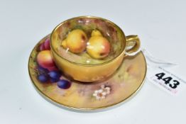 A ROYAL WORCESTER FALLEN FRUITS SMALL TEACUP AND SAUCER, the cup with gilt exterior, interior