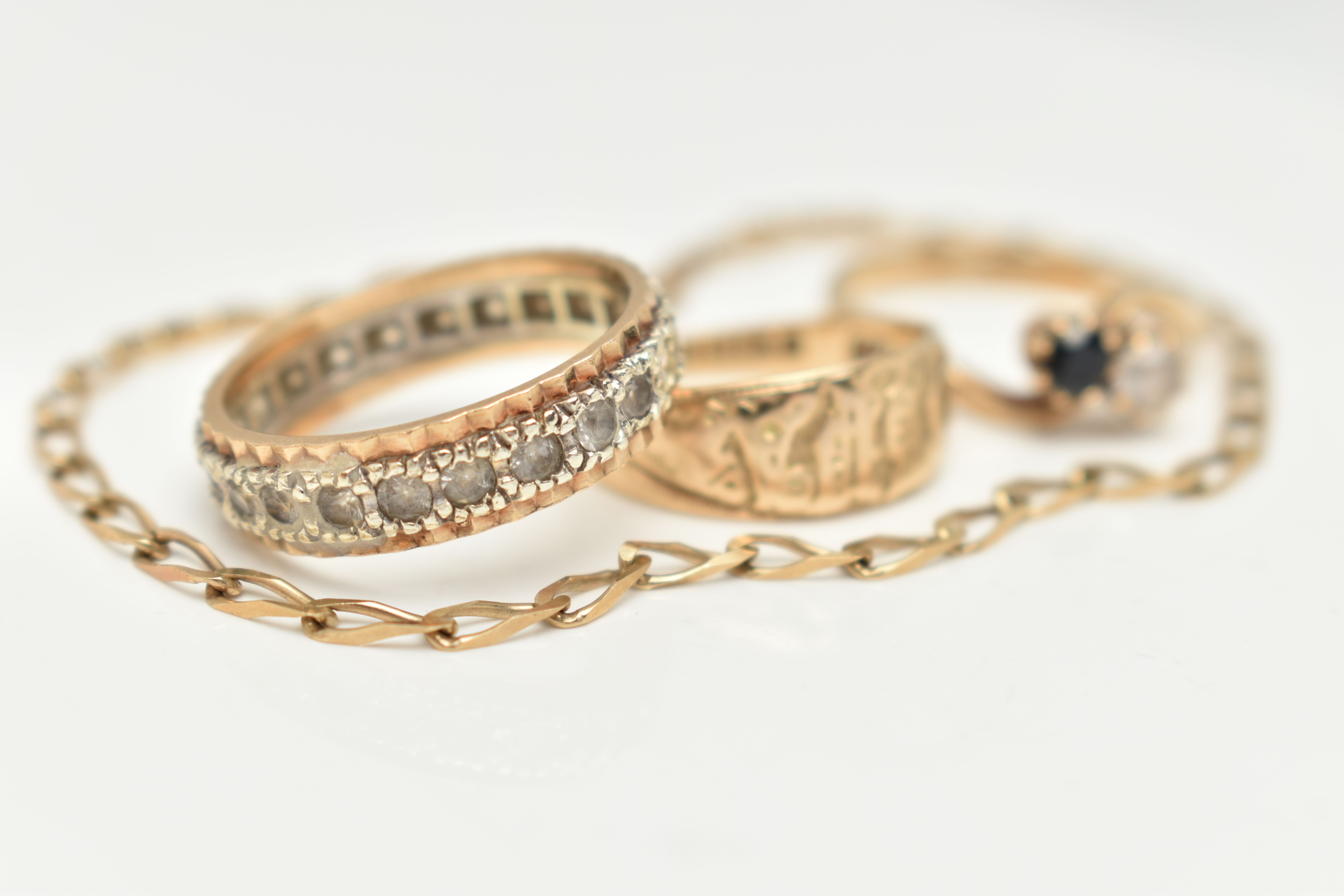 A 9CT GOLD BRACELET AND THREE RINGS, a yellow gold elongated curb link bracelet, fitted with a - Image 3 of 5