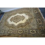 A PRADO KASHAN SUPER RUG, with a beige field, central medallion, repeating foliate patterns and a