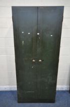 VICKERS ARMSTRONG, AN INDUSTRIAL GREEN DOUBLE DOOR METAL CABINET, with five adjustable shelves,